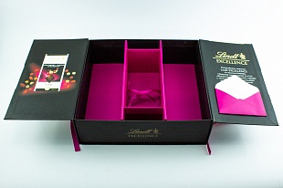 Кашированная коробка из переплетного картона шкатулка Lindt черная с лентами
